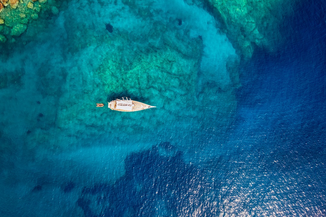 Aerial,Top,Down,View,Of,A,Sailing,Boat,Anchored,On